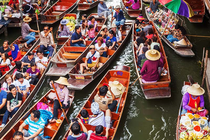 tourists at Damnoen Saduak in Thailand